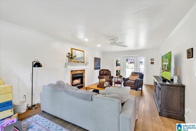 113 Pine Cliff Cir, Hoover, AL 35226 - living area featuring crown molding, a glass covered fireplace, a ceiling fan, light wood finished floors, and recessed lighting
