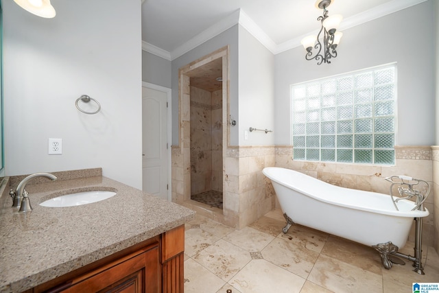295 Ridge View Way, Springville, AL 35146 - full bath featuring ornamental molding, a soaking tub, a stall shower, vanity, and tile walls