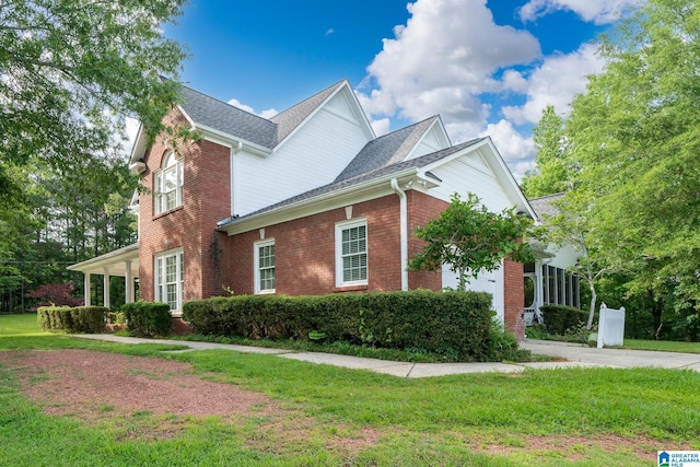 295 Ridge View Way, Springville, AL 35146 - view of home's exterior with a yard, brick siding, and a shingled roof