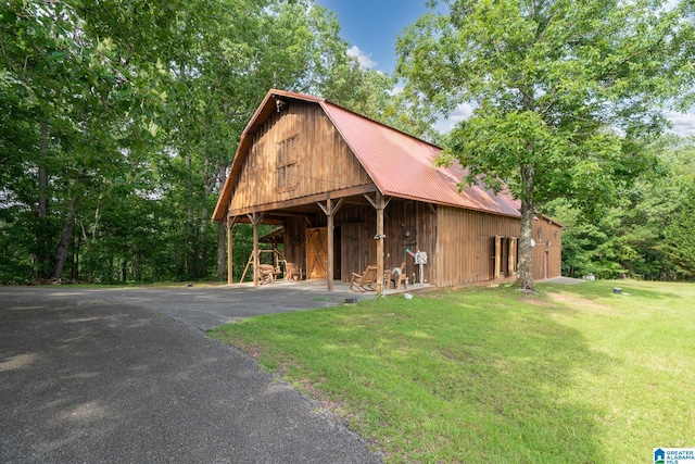 295 Ridge View Way, Springville, AL 35146 - rustic home featuring a front yard, metal roof, a barn, an outbuilding, and driveway