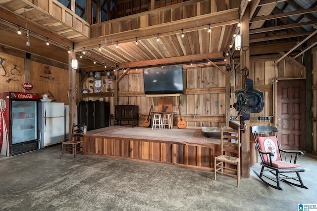 295 Ridge View Way, Springville, AL 35146 - miscellaneous room with track lighting, wood walls, and concrete flooring