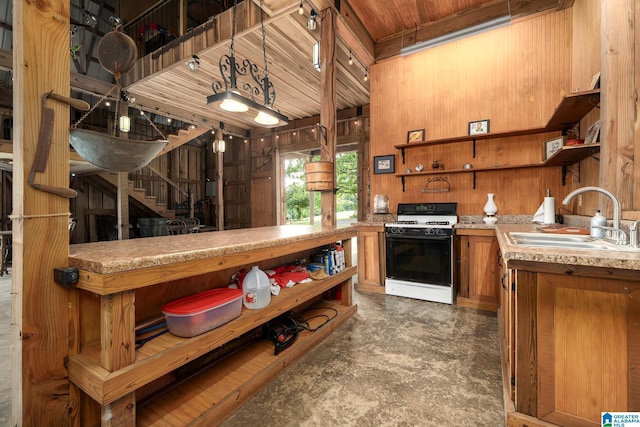 295 Ridge View Way, Springville, AL 35146 - kitchen featuring open shelves, range with gas cooktop, a sink, brown cabinets, and light countertops