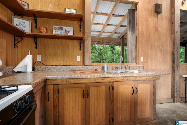 295 Ridge View Way, Springville, AL 35146 - kitchen featuring open shelves, a sink, light countertops, brown cabinetry, and gas range oven