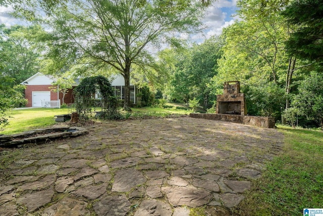 295 Ridge View Way, Springville, AL 35146 - view of patio with an outdoor stone fireplace