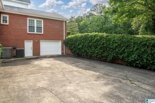 295 Ridge View Way, Springville, AL 35146 - garage with cooling unit and driveway