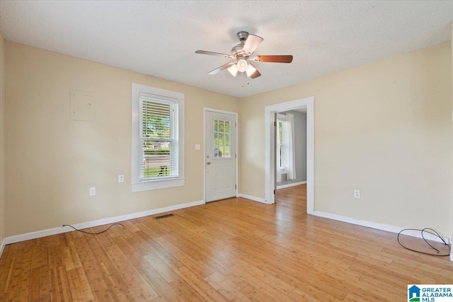 114NW Morgan Ave, Cullman, AL 35055 - spare room with ceiling fan, light wood-style flooring, and baseboards