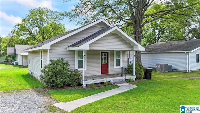 114NW Morgan Ave, Cullman, AL 35055 - view of front facade featuring covered porch, a front lawn, and central AC