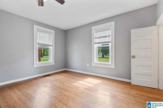 114NW Morgan Ave, Cullman, AL 35055 - spare room featuring healthy amount of natural light, wood finished floors, baseboards, and ceiling fan