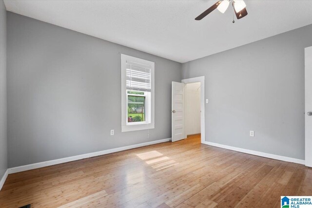 114NW Morgan Ave, Cullman, AL 35055 - unfurnished bedroom featuring wood-type flooring, baseboards, and ceiling fan