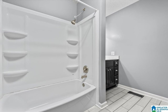 114NW Morgan Ave, Cullman, AL 35055 - full bathroom featuring bathing tub / shower combination, vanity, and baseboards