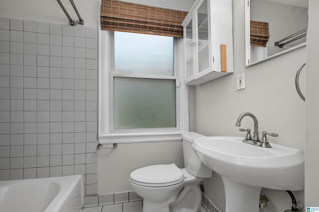4763 7th Ct S, Birmingham, AL 35222 - full bath with toilet, tile patterned flooring, bathing tub / shower combination, and a sink