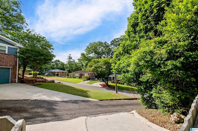 4763 7th Ct S, Birmingham, AL 35222 - view of green lawn with a residential view and driveway