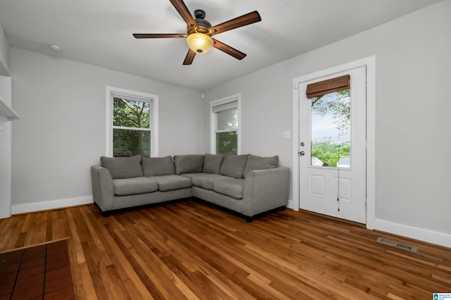 4763 7th Ct S, Birmingham, AL 35222 - living area with a ceiling fan, plenty of natural light, hardwood / wood-style flooring, and baseboards