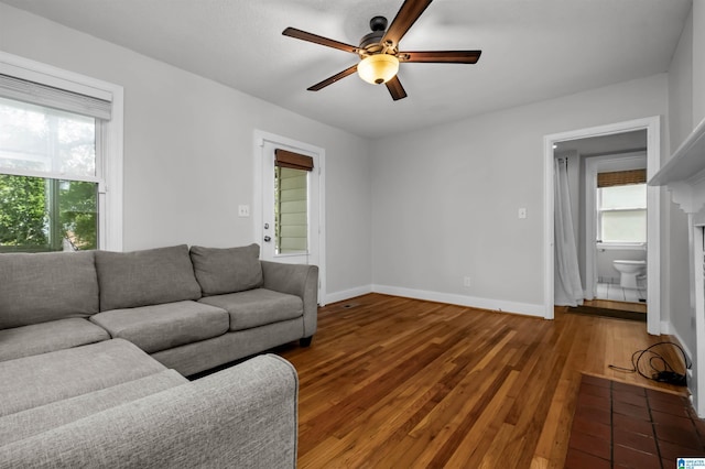 4763 7th Ct S, Birmingham, AL 35222 - living area with ceiling fan, hardwood / wood-style floors, healthy amount of natural light, and baseboards