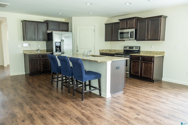 222 Sarah Way, Kimberly, AL 35091 - kitchen featuring appliances with stainless steel finishes, dark wood-style flooring, recessed lighting, a sink, and an island with sink