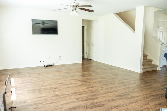 222 Sarah Way, Kimberly, AL 35091 - unfurnished living room with wood finished floors, ceiling fan, stairway, and baseboards