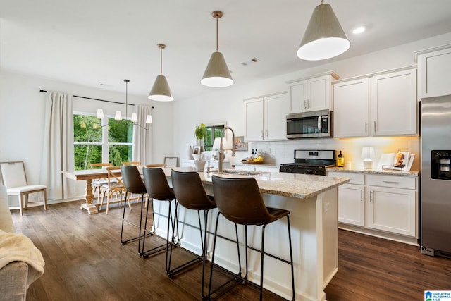 464 Crossbridge Rd, Chelsea, AL 35043 - kitchen with appliances with stainless steel finishes, a sink, tasteful backsplash, and white cabinetry