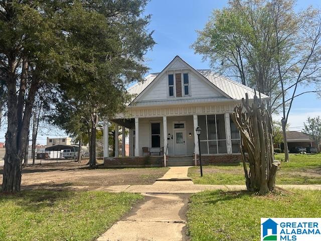 1711 5th Ave N, Bessemer, AL 35020 - view of front of house with covered porch and a front lawn