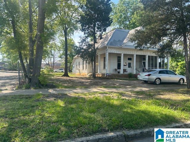 1711 5th Ave N, Bessemer, AL 35020 - view of front facade featuring covered porch