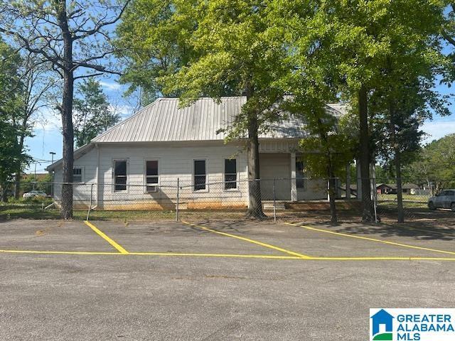 1711 5th Ave N, Bessemer, AL 35020 - view of front of house featuring uncovered parking and metal roof