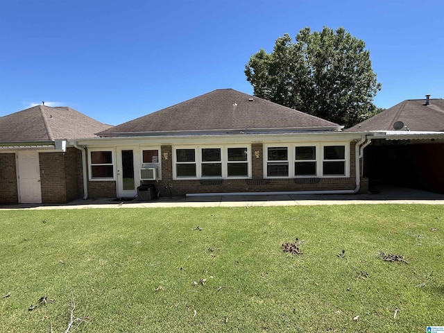 50 Ashton Ln, Sylacauga, AL 35150 - rear view of property with brick siding, a lawn, cooling unit, and roof with shingles