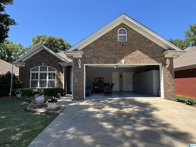50 Ashton Ln, Sylacauga, AL 35150 - view of front of house with brick siding, driveway, a garage, and a front lawn