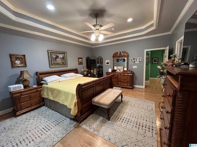 50 Ashton Ln, Sylacauga, AL 35150 - bedroom featuring a tray ceiling, ornamental molding, baseboards, recessed lighting, and light wood-style flooring