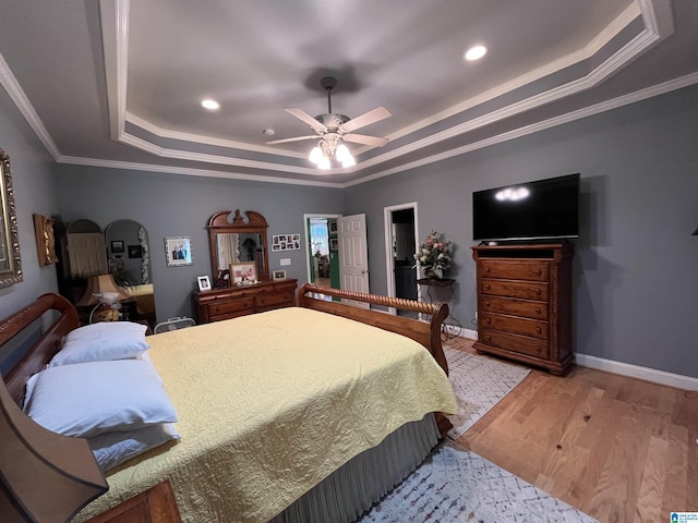 50 Ashton Ln, Sylacauga, AL 35150 - bedroom featuring a tray ceiling, light wood-type flooring, recessed lighting, ornamental molding, and baseboards