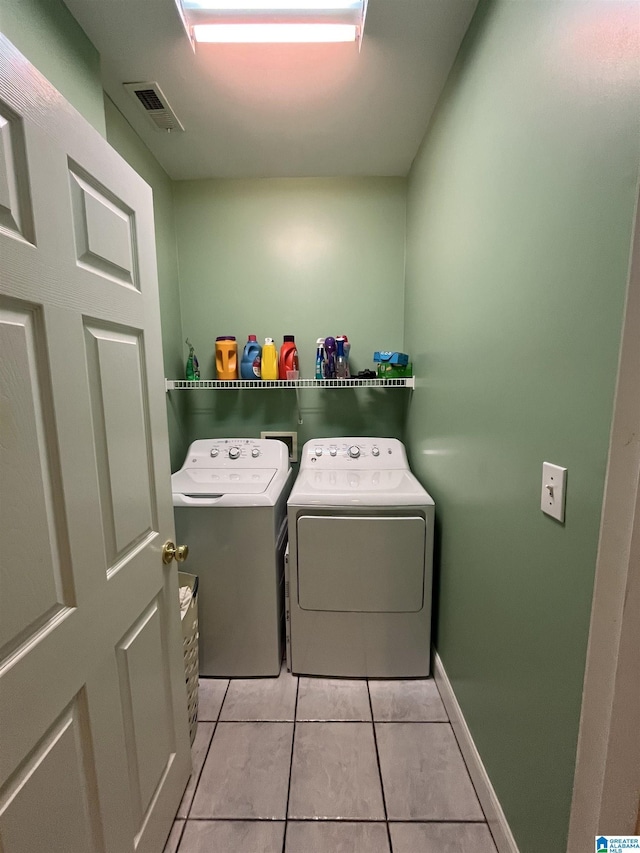 50 Ashton Ln, Sylacauga, AL 35150 - laundry area featuring separate washer and dryer, light tile patterned floors, and baseboards
