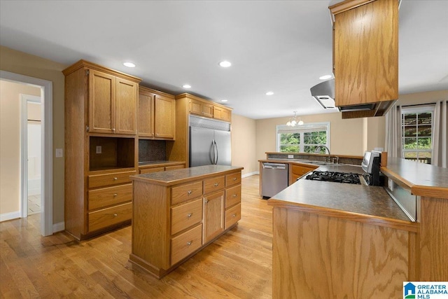 255 Savannah Ln, Cleveland, AL 35049 - kitchen featuring stainless steel appliances, a kitchen island, light wood-style flooring, recessed lighting, and a sink
