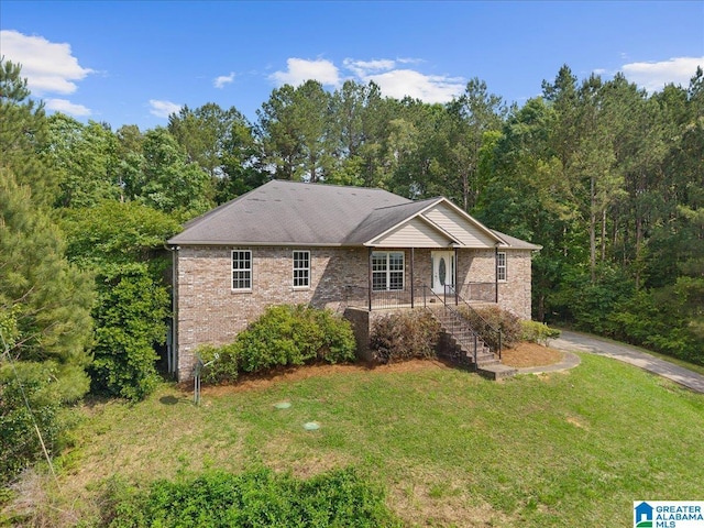 255 Savannah Ln, Cleveland, AL 35049 - single story home with a front lawn, brick siding, and a view of trees