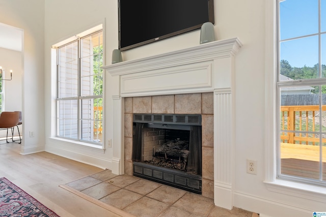 773 Old Cahaba Dr, Helena, AL 35080 - detailed view of a tile fireplace, wood finished floors, and baseboards