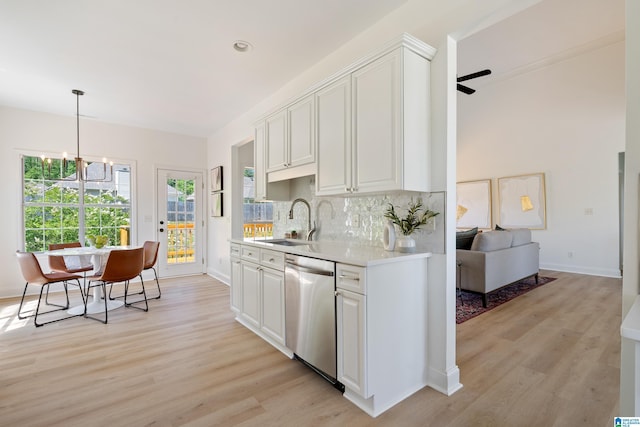 773 Old Cahaba Dr, Helena, AL 35080 - kitchen with stainless steel dishwasher, a sink, light countertops, light wood-style floors, and a chandelier