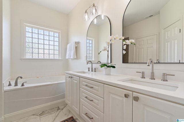 773 Old Cahaba Dr, Helena, AL 35080 - bathroom featuring marble look tiles, double vanity, and a bath