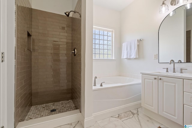 773 Old Cahaba Dr, Helena, AL 35080 - bathroom with marble look tiles, a garden tub, vanity, and a tile shower