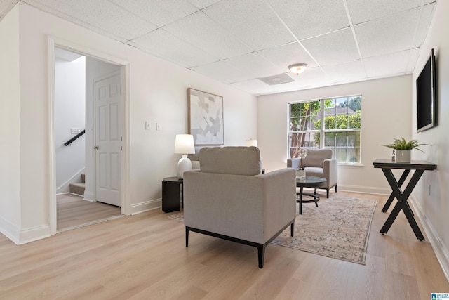 773 Old Cahaba Dr, Helena, AL 35080 - living area featuring a drop ceiling, light wood finished floors, stairway, and baseboards