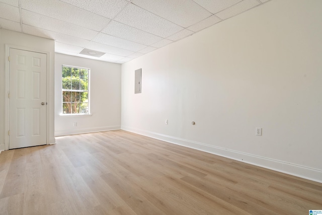 773 Old Cahaba Dr, Helena, AL 35080 - unfurnished room with light wood-style flooring, a paneled ceiling, electric panel, and baseboards