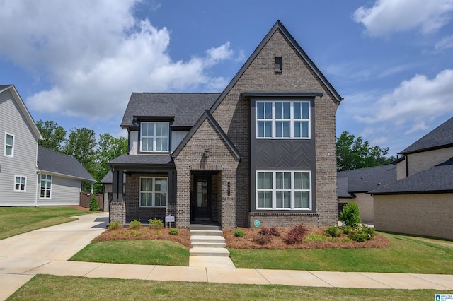 4651 Silas Ave, Hoover, AL 35244 - view of front facade with brick siding, a front yard, and a shingled roof