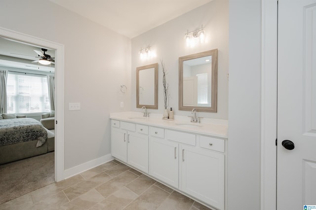 4651 Silas Ave, Hoover, AL 35244 - full bathroom with double vanity, connected bathroom, a ceiling fan, baseboards, and tile patterned flooring