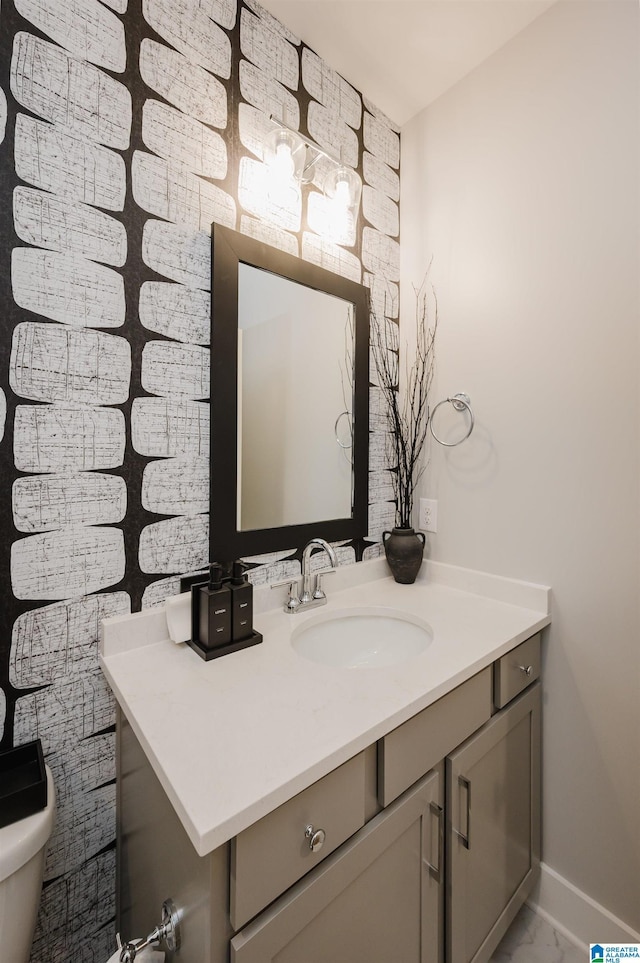 4651 Silas Ave, Hoover, AL 35244 - half bathroom featuring vanity, toilet, and baseboards