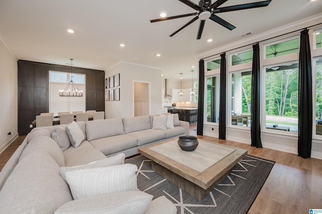 4651 Silas Ave, Hoover, AL 35244 - living room with a chandelier, crown molding, a ceiling fan, wood finished floors, and recessed lighting