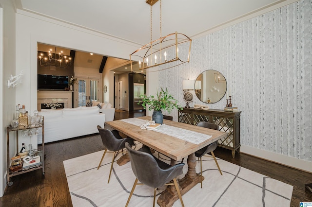 112 Perry Pl, Birmingham, AL 35242 - dining room featuring a chandelier, wallpapered walls, baseboards, and wood finished floors