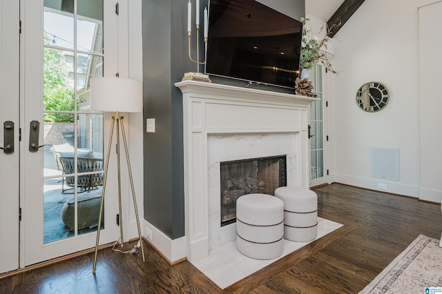 112 Perry Pl, Birmingham, AL 35242 - living area with wood finished floors, baseboards, a high end fireplace, and beamed ceiling