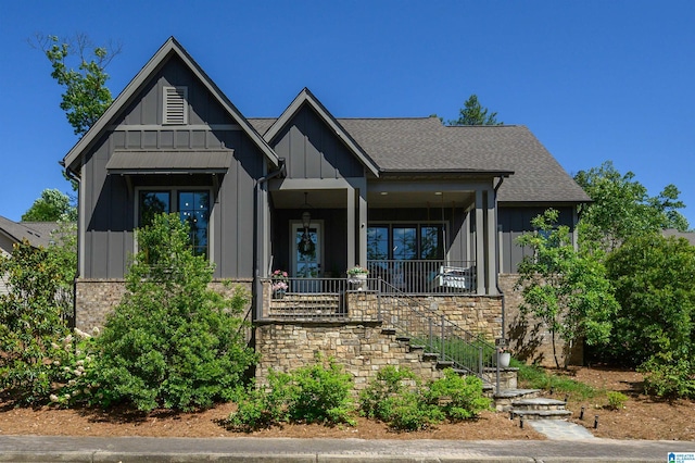 112 Perry Pl, Birmingham, AL 35242 - view of front of home with board and batten siding, a porch, stairs, and stone siding