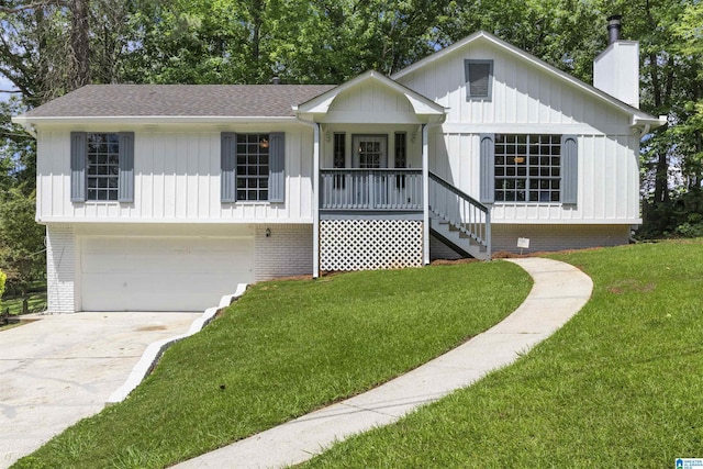 1718 Teakwood Ln, Birmingham, AL 35235 - view of front of house featuring a chimney, an attached garage, stairs, a front yard, and a porch