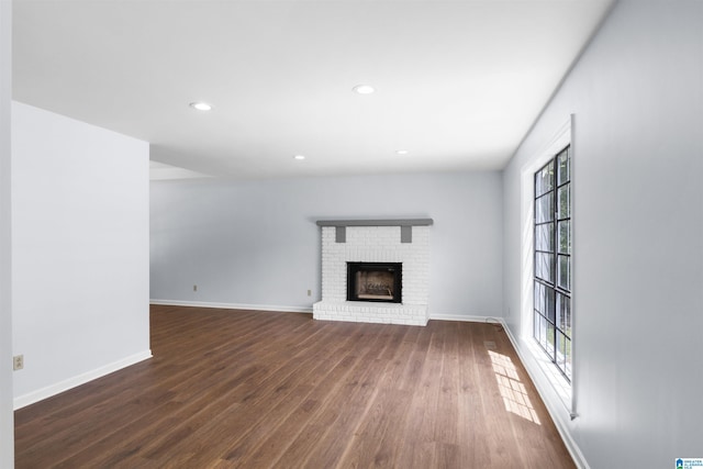 1718 Teakwood Ln, Birmingham, AL 35235 - unfurnished living room featuring dark wood finished floors, a brick fireplace, baseboards, and recessed lighting