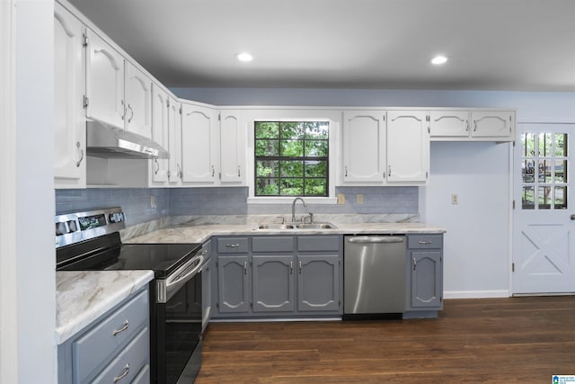 1718 Teakwood Ln, Birmingham, AL 35235 - kitchen featuring appliances with stainless steel finishes, under cabinet range hood, a sink, gray cabinets, and plenty of natural light