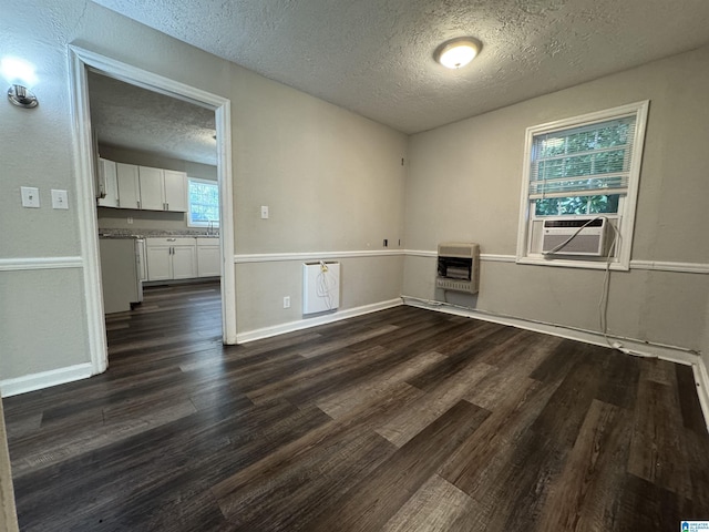804 Elm Ave, Gadsden, AL 35903 - unfurnished room featuring heating unit, a textured ceiling, cooling unit, dark wood-type flooring, and baseboards