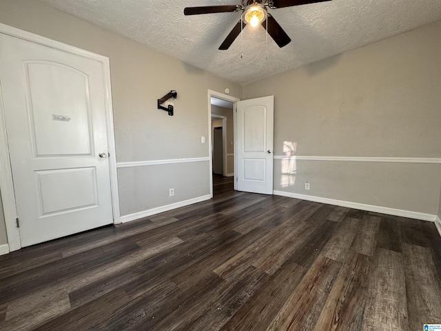 804 Elm Ave, Gadsden, AL 35903 - unfurnished bedroom featuring a textured ceiling, dark wood finished floors, baseboards, and ceiling fan