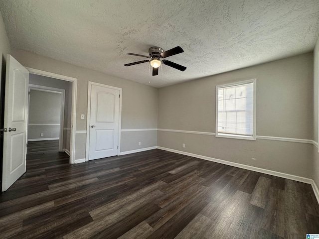 804 Elm Ave, Gadsden, AL 35903 - spare room featuring a textured ceiling, ceiling fan, dark wood-style floors, and baseboards